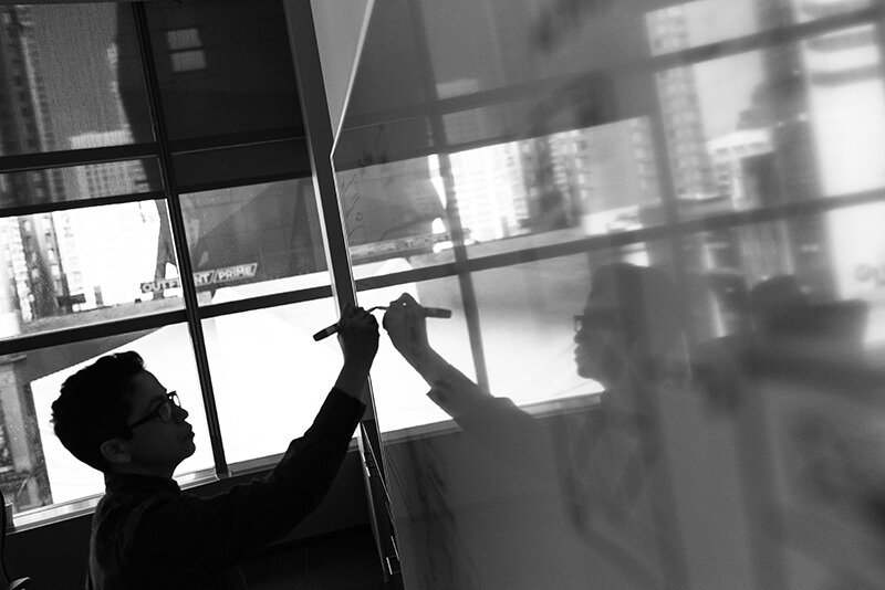 Person standing in front of whiteboard